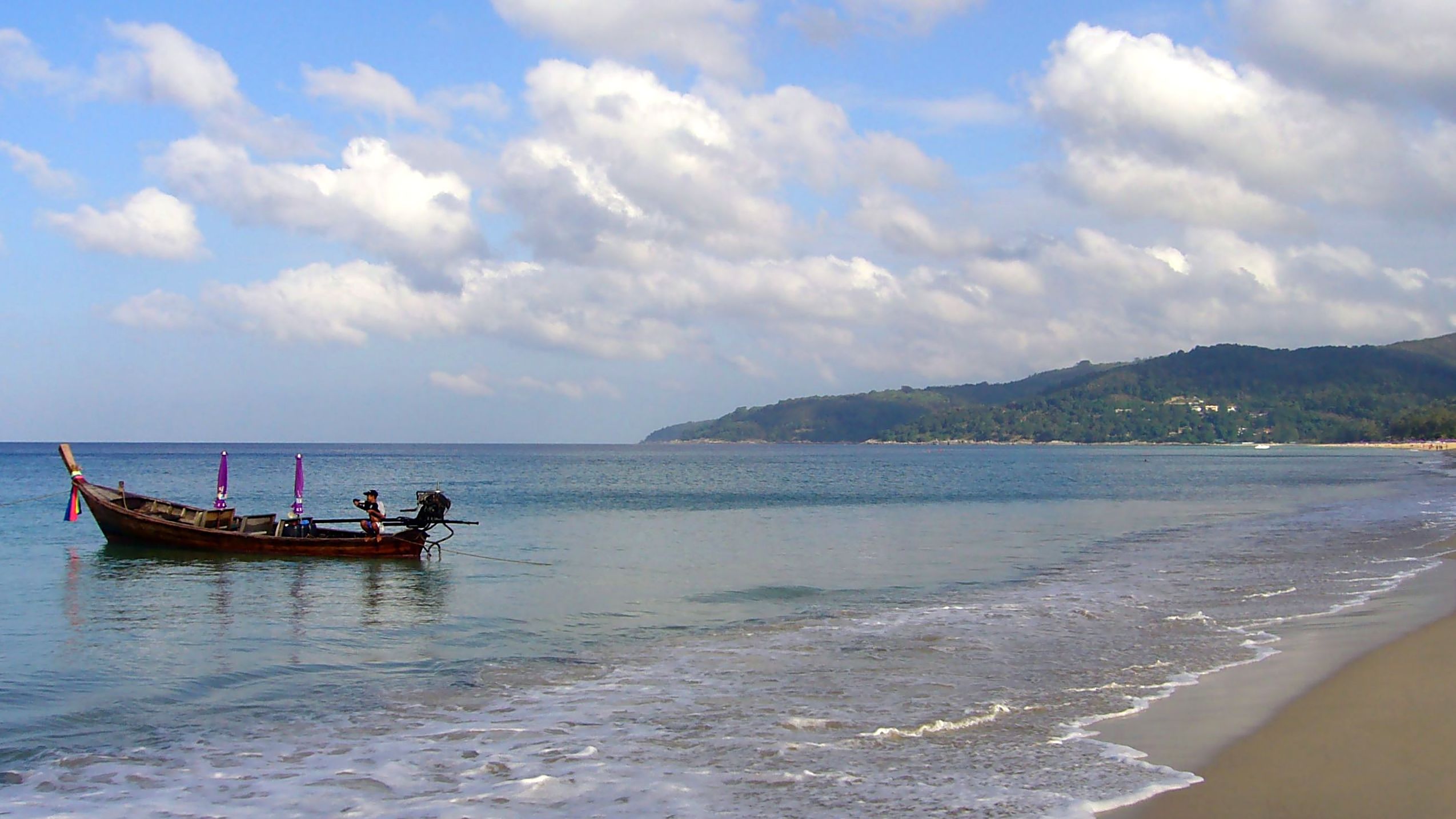 A shikara on Dal Lake with the Himalayas, Srinagar, Kashmir